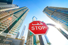 stop sign tall building