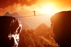 STOCK man on tightrope risk danger