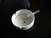 Cigarette in ashtray smoking